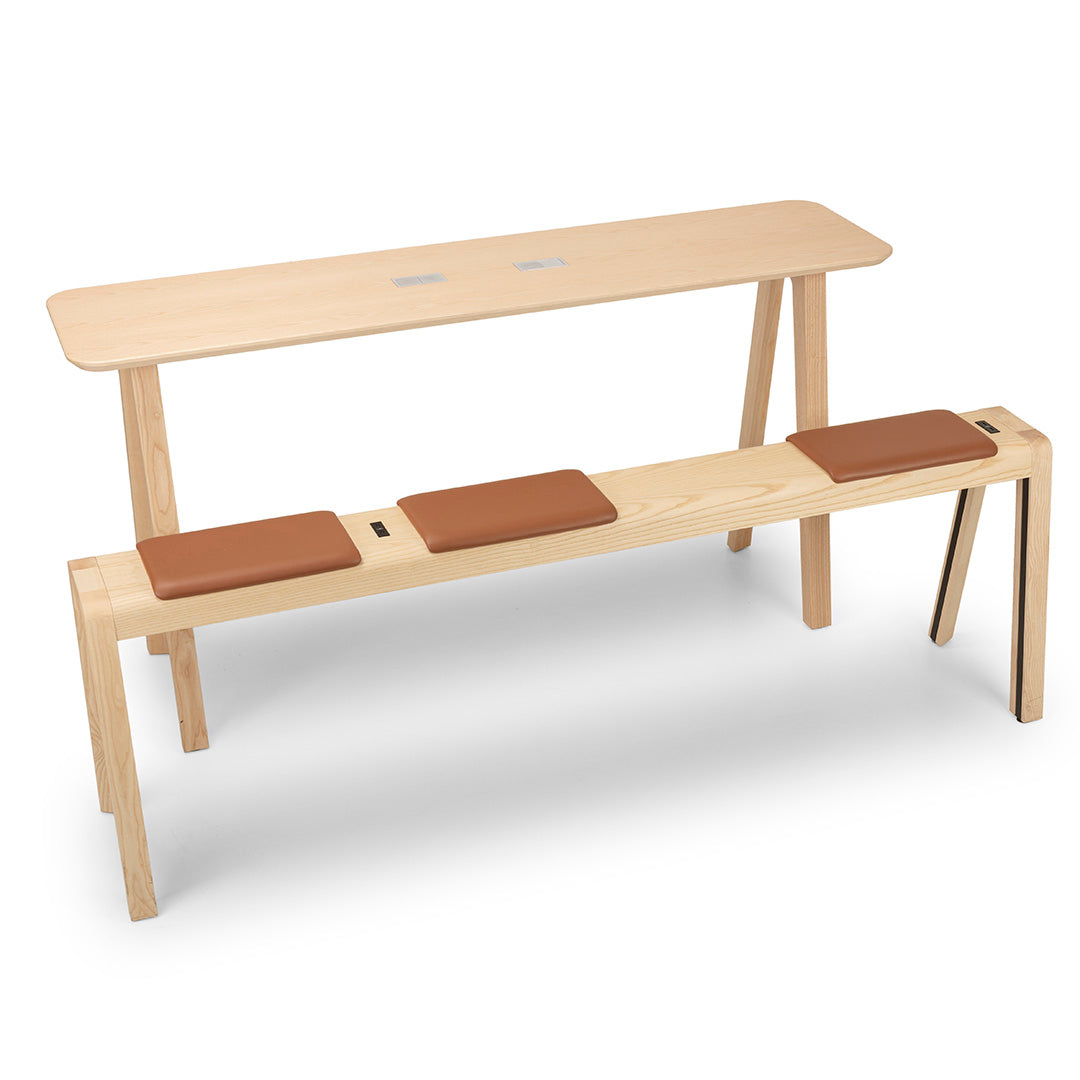 Light wood table and bench with brown leather seat pads, featuring a minimalist design and natural finish.