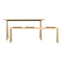 Light wood dining table set with a smooth, minimalist design and subtle brown accents on the benches.