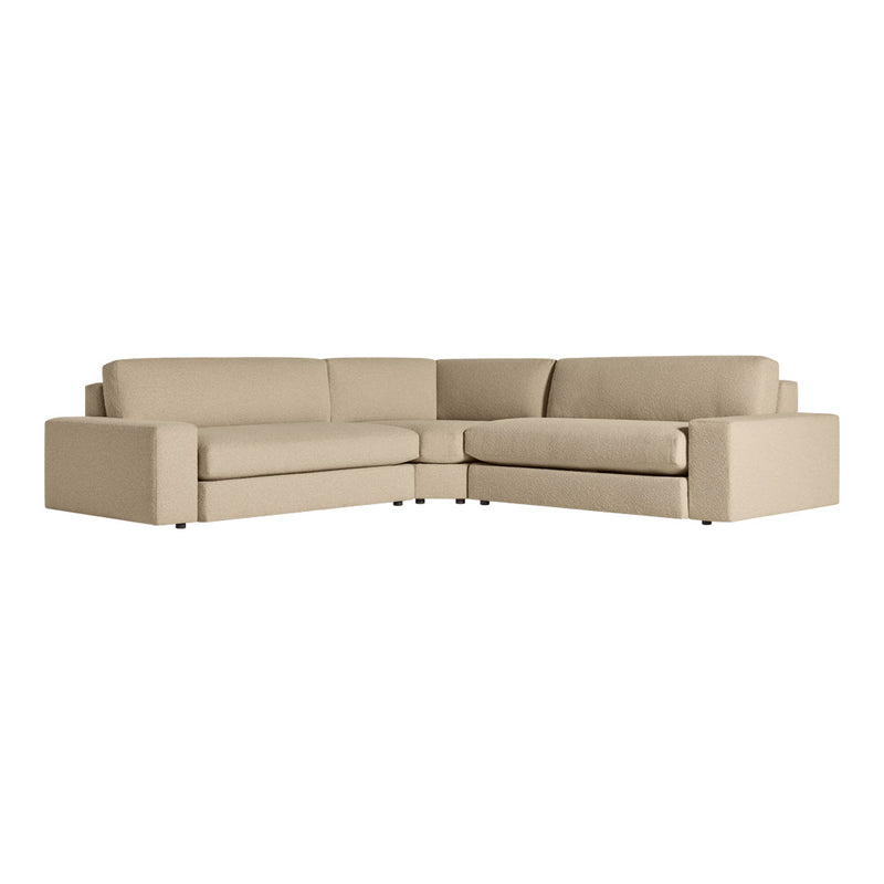 Beige L-shaped sofa with smooth upholstery, featuring clean lines and a modern, minimalist design.