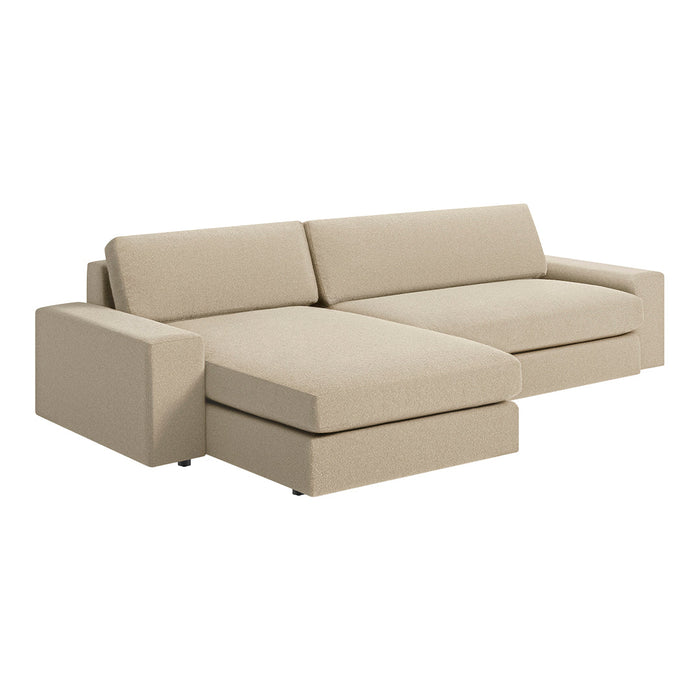 Beige sectional sofa with smooth, solid fabric and contemporary design featuring clean lines. Perfect for modern interiors.