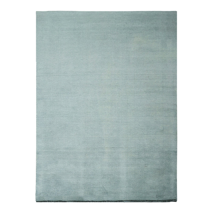 Soft aqua blue area rug with a smooth, solid texture, perfect for modern or coastal-themed decor.