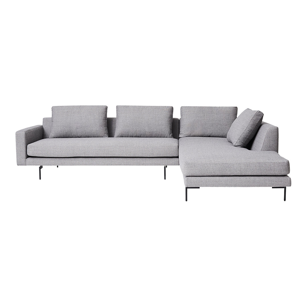 Gray sectional sofa with a sleek design, featuring solid color cushions and metal legs for a modern look.