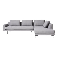 Gray sectional sofa with a sleek design, featuring solid color cushions and metal legs for a modern look.