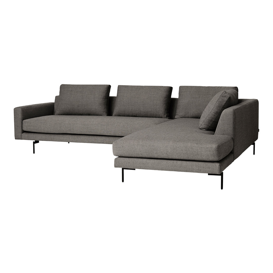Gray sectional sofa with clean lines, featuring a textured fabric and minimalistic design, perfect for modern decor.