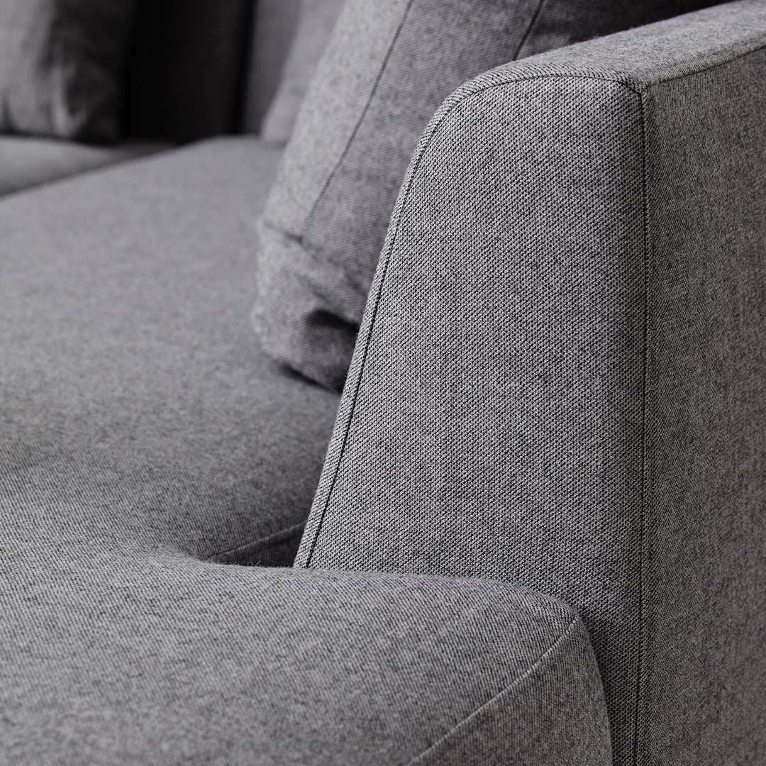 Gray textured fabric sofa with modern, clean lines and subtle patterns for a contemporary look.