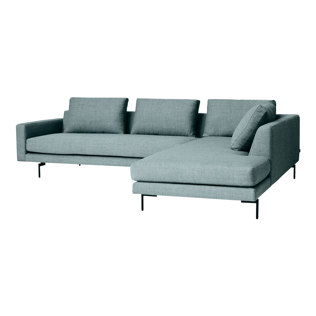 Light blue sectional sofa with a smooth fabric texture and minimalist design, featuring three plush cushions.