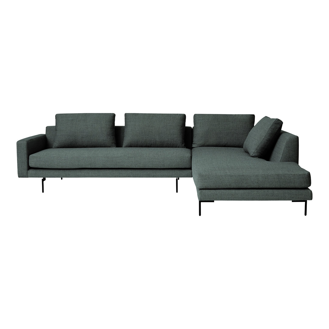 Dark green sectional sofa with sleek lines and modern design, featuring solid upholstery and minimalist black legs.