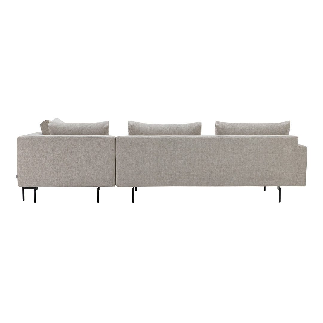 Light beige sofa with a smooth texture and simple, modern design, featuring plush cushions and sleek black legs.