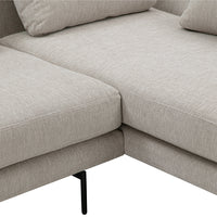 Light beige sectional sofa with a subtle texture, featuring minimalist design and black metal legs.