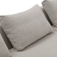 Light gray textured pillows on a soft beige sofa, offering a modern and cozy look for any living space.