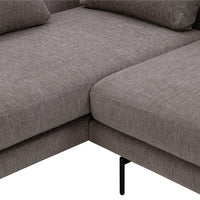 Gray textured fabric sectional sofa with minimalistic black metal legs and soft, subtle pattern accents.