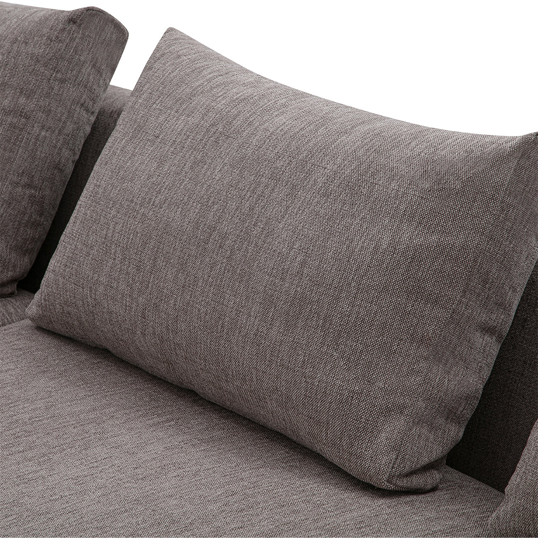 Gray textured couch with a matching cushion, showcasing a soft, subtle pattern. Perfect for modern home decor.