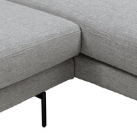 Gray textured fabric upholstery on sectional sofa with sleek black metal legs. Modern and versatile design.