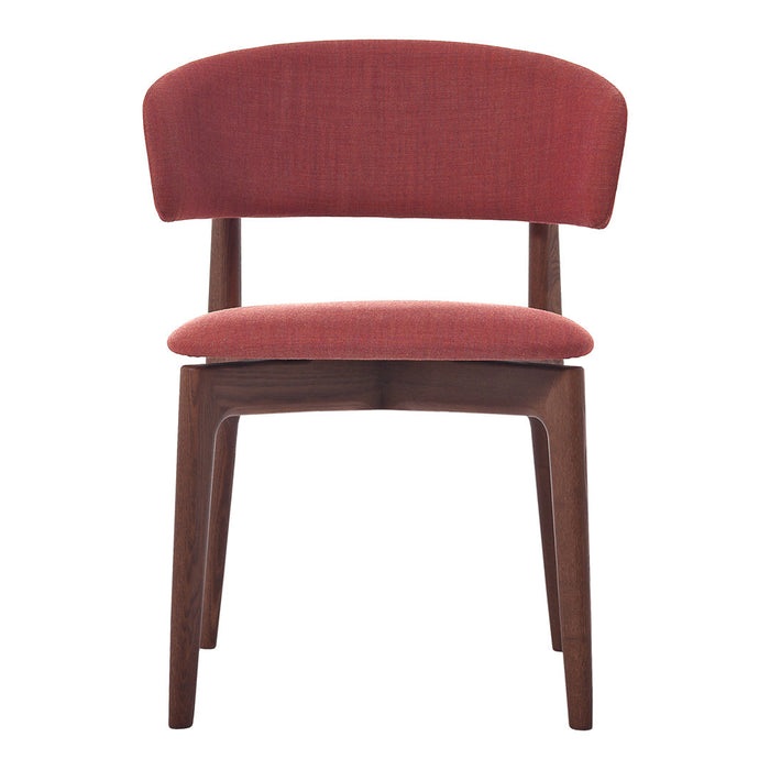 "Modern chair in rich terracotta fabric with a smooth wooden frame and minimalist design."