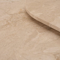 Beige marble surface with smooth texture and subtle natural veining patterns. Ideal for elegant home decor.