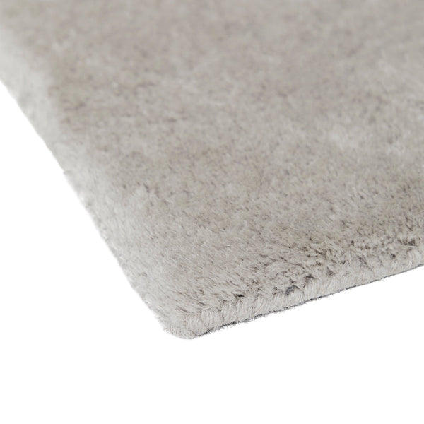 Soft gray plush rug with a sleek, solid texture, perfect for modern decor.
