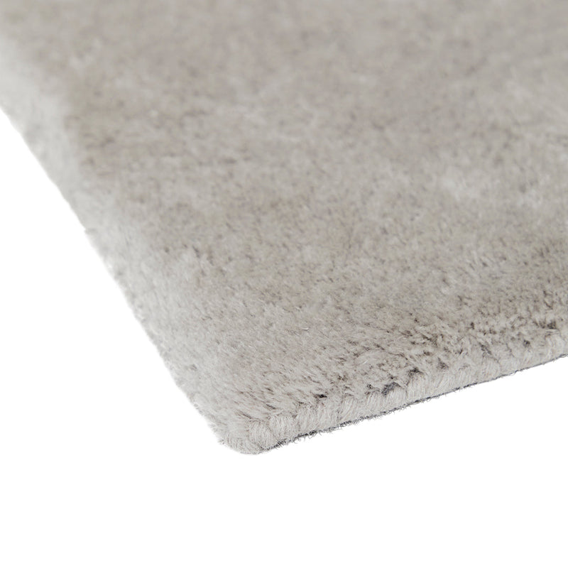 Soft gray plush rug with a sleek, solid texture, perfect for modern decor.