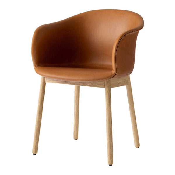 Brown leather chair with smooth curves and wooden legs, showcasing a sleek, modern design.