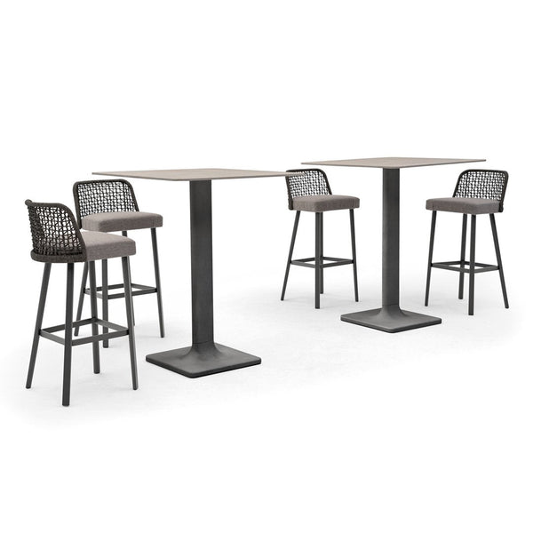 Modern outdoor bar set featuring gray metal tables and black woven chairs with beige cushions. Stylish and contemporary design.