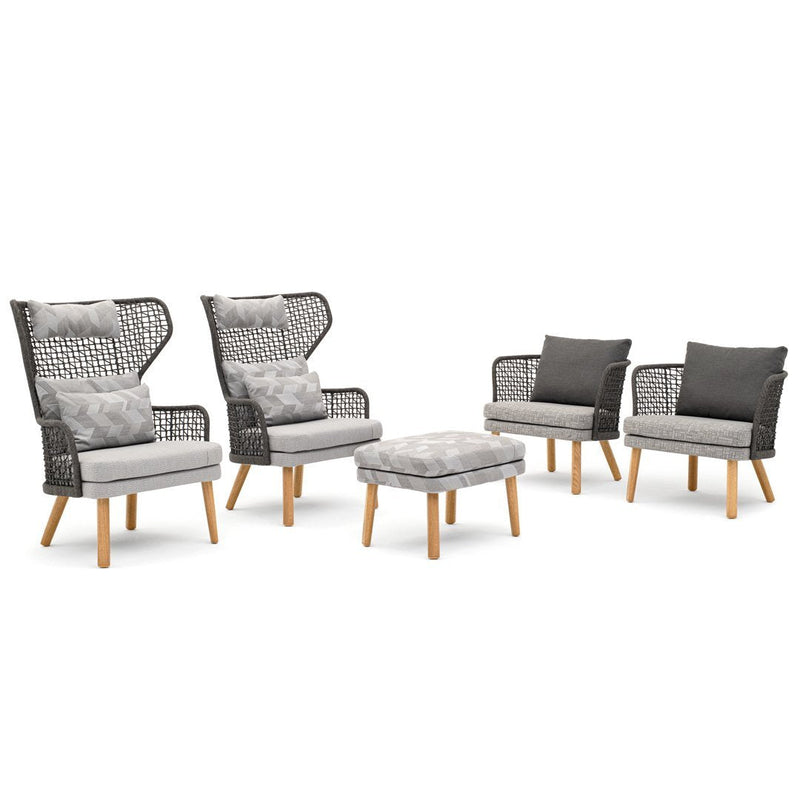 Gray and white patterned cushions with black wicker chairs and light wood legs in a stylish patio furniture set.