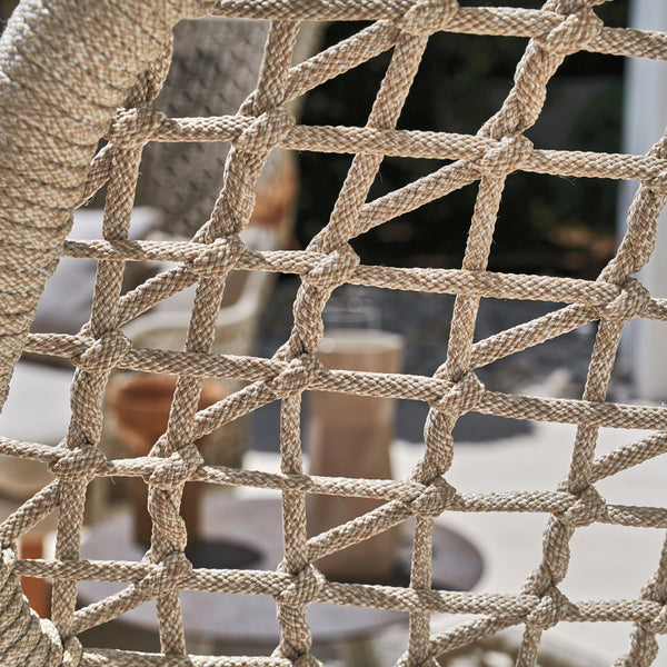Natural beige woven rope pattern with a geometric grid design, ideal for outdoor decor and stylish seating solutions.
