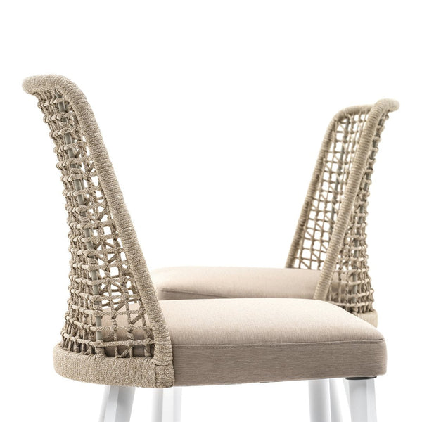 Beige woven chair with textured rope detailing and a soft, neutral cushion, perfect for modern interiors.
