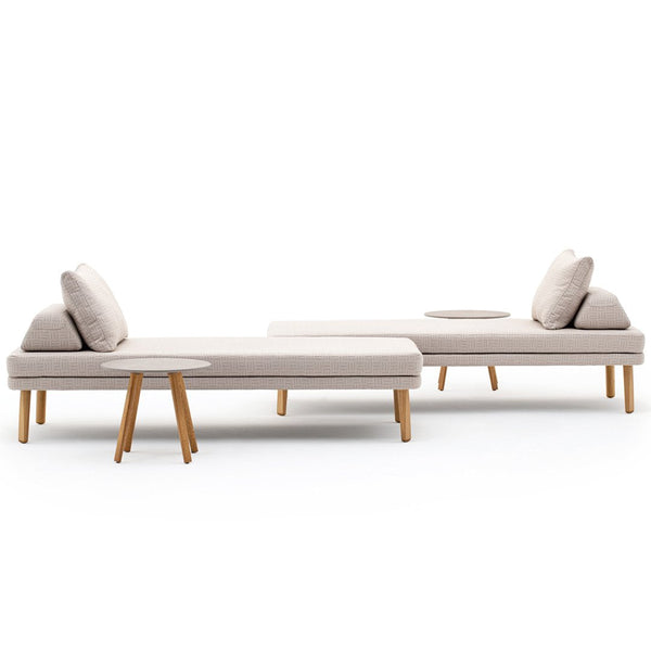 Neutral beige upholstery with soft texture, complemented by light wood legs in a minimalist design.