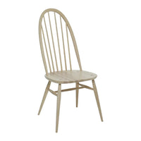 Light wood dining chair with a natural finish and minimalist spindle back design. Ideal for modern and rustic decor.