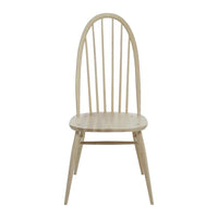 Light natural wood dining chair with a minimalist design featuring vertical slats and tapered legs.