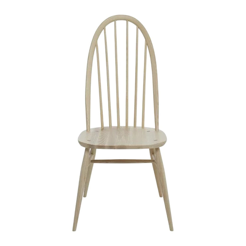 Light natural wood dining chair with a minimalist design featuring vertical slats and tapered legs.