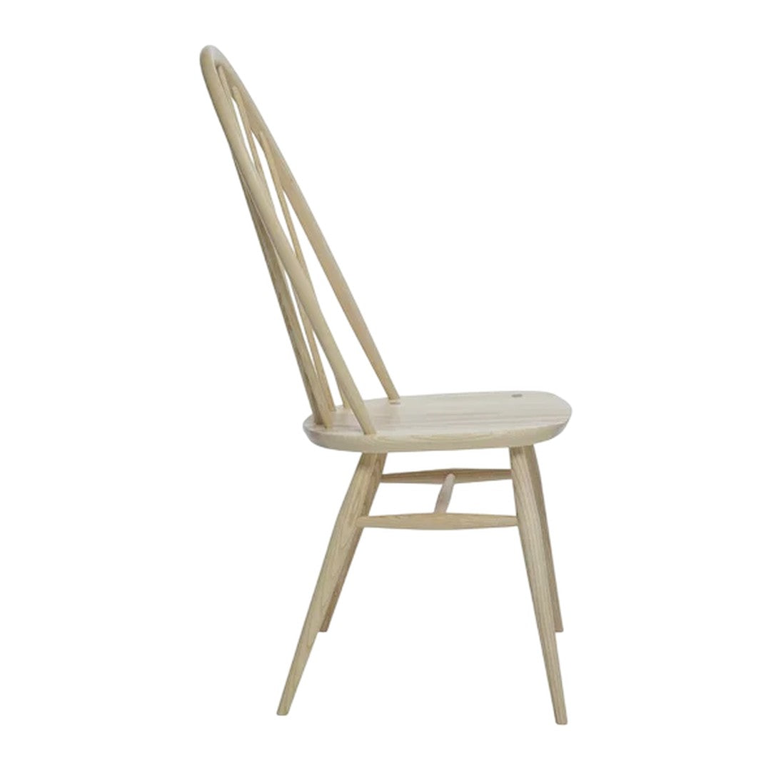 Light wood chair with natural finish and minimalist design, showcasing smooth grains and elegant curves.