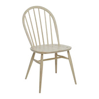 Light natural wood chair with a simple design featuring a curved back and slatted detailing.