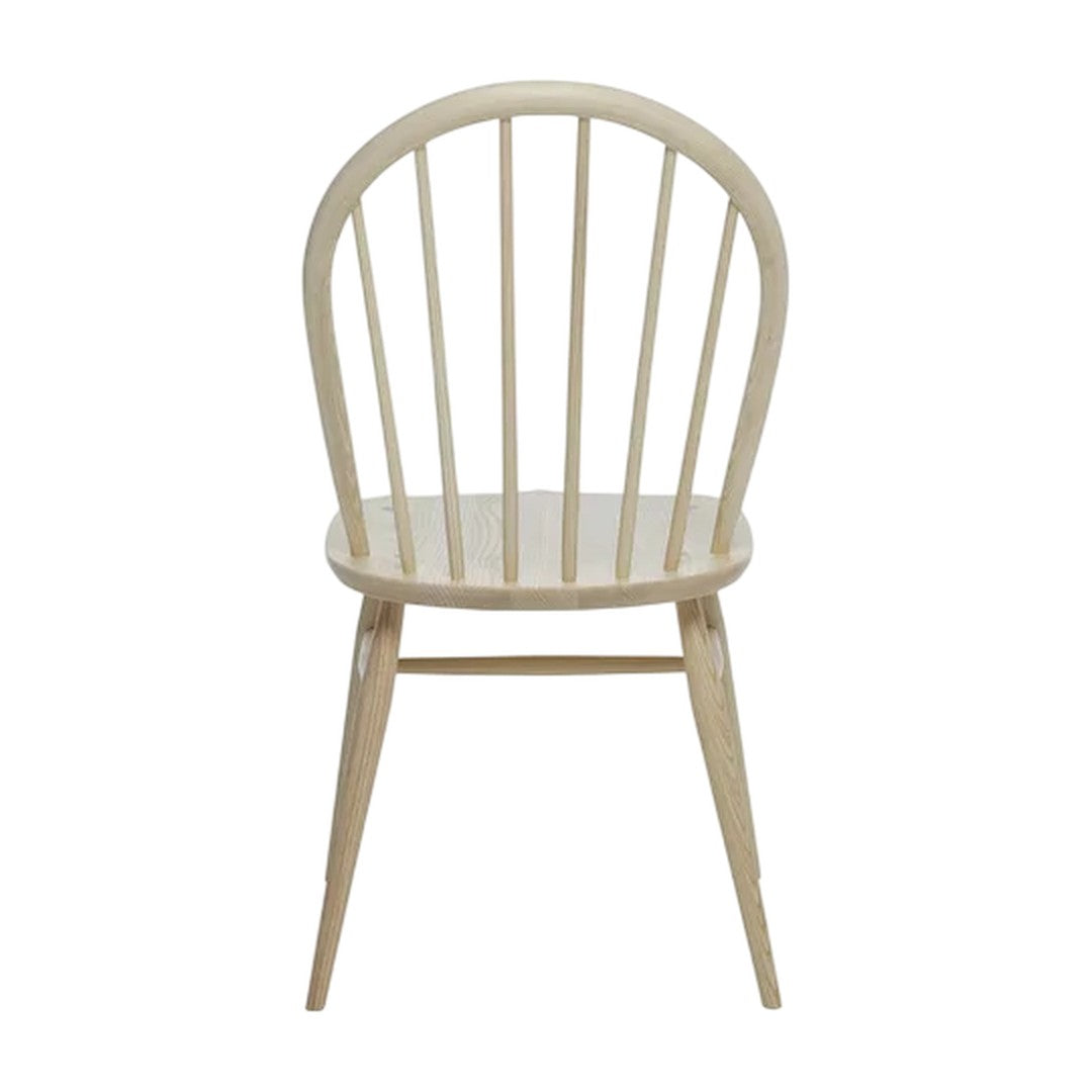 Natural wood finish with a light, beige color and a classic spindle-back design. Simple and elegant style.