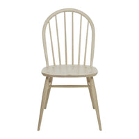 Light wood dining chair with a natural finish and simple, classic spindled back design. Ideal for minimalist decor.