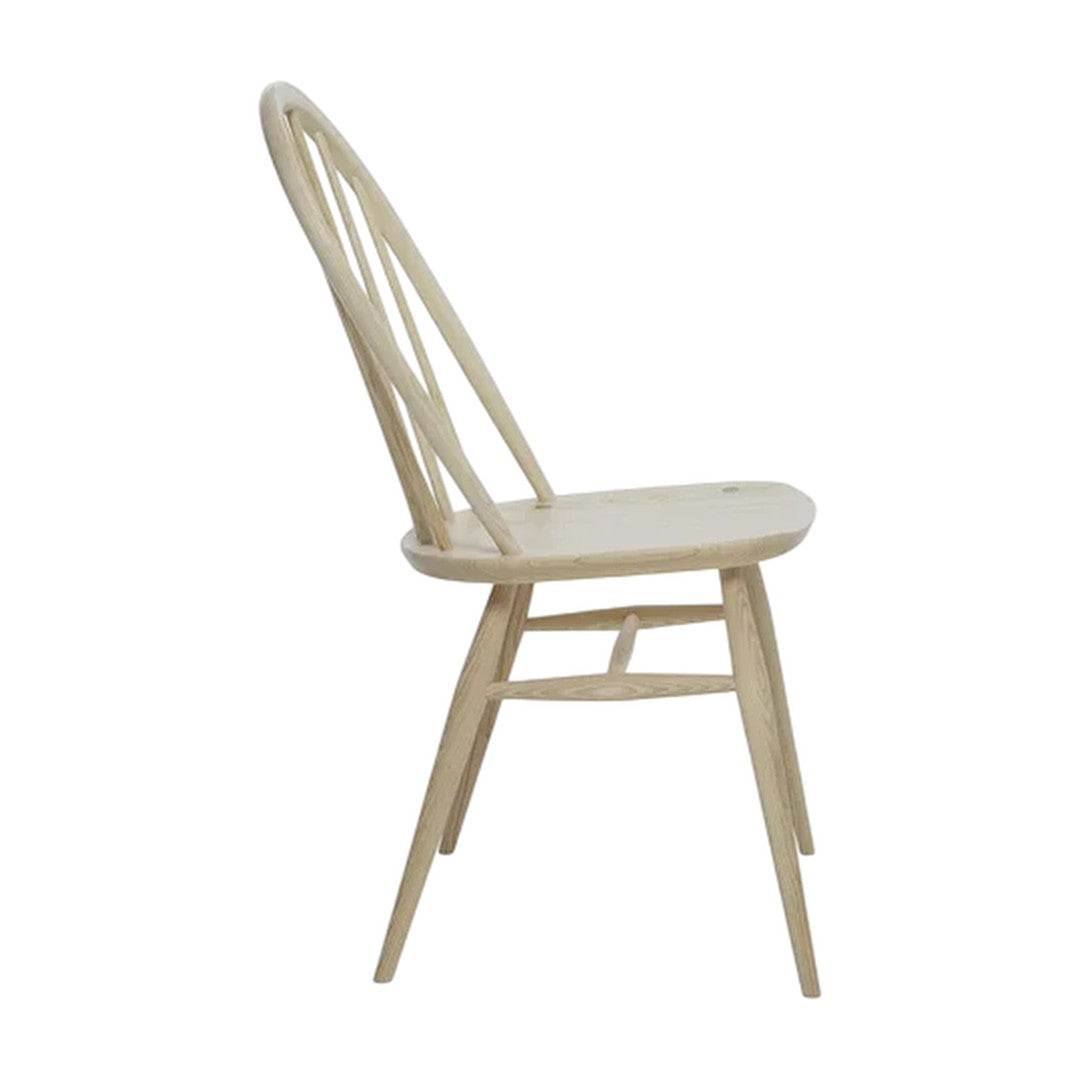 Natural wood chair in light beige with a minimalist design and smooth, sleek finish.