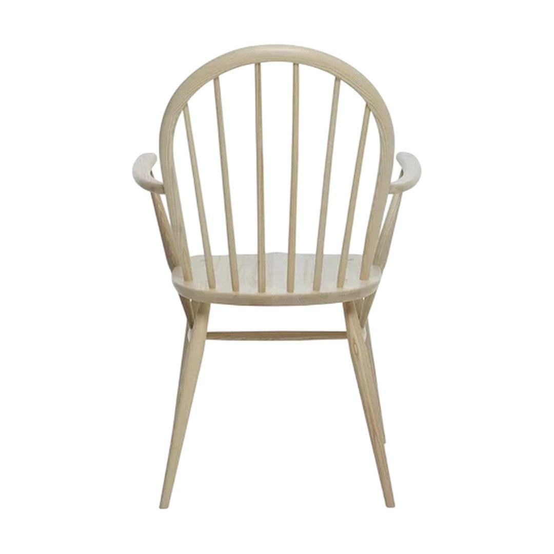 Light wood finish with a smooth texture, featuring a classic spindle back and elegant curved arms.