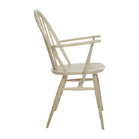 Natural wood color with smooth grain, featuring a minimalist design and classic spindle back pattern.