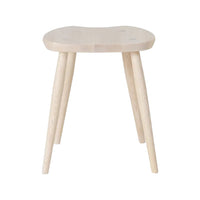 Natural wood stool with a light finish and smooth surface, featuring circular cutouts and tapered legs.