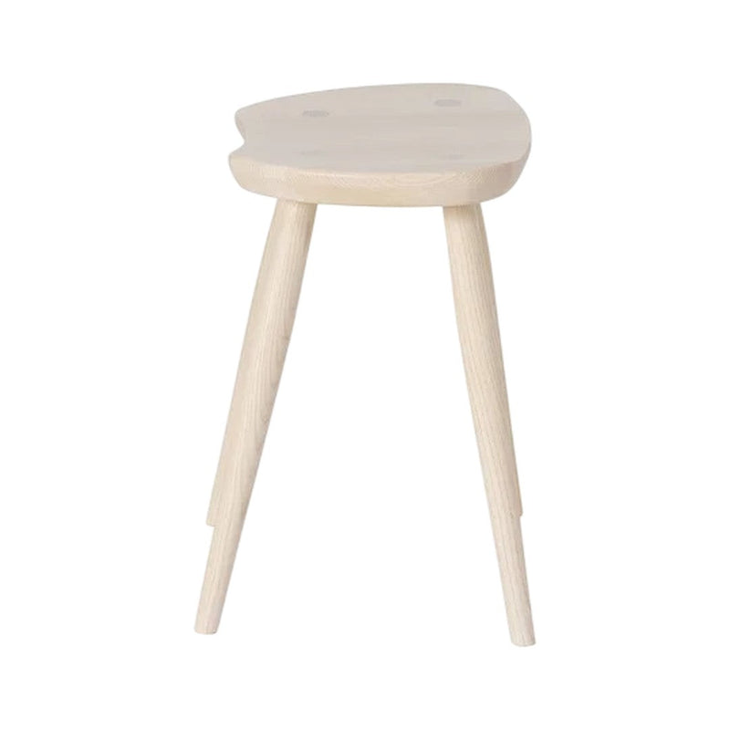 Light wood stool with a smooth, natural finish and minimalistic design, featuring a unique organic shape and three legs.