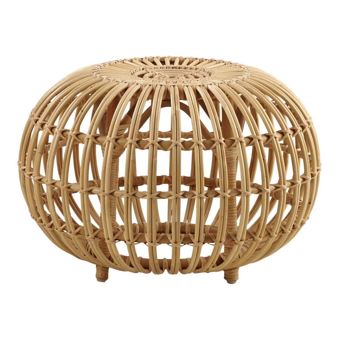 Round rattan pouf in natural beige tones with an open woven pattern, adding a touch of organic elegance to any space.