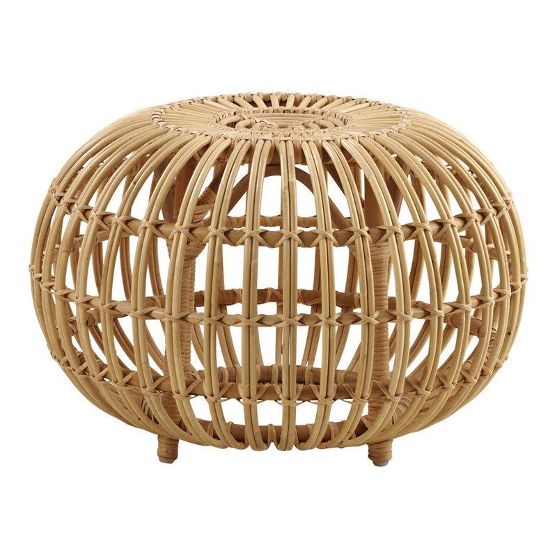Natural woven rattan ottoman with a circular shape and intricate open pattern in light brown tones.