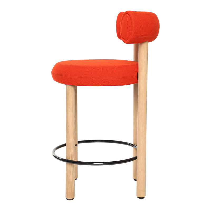 Bright orange bar stool with minimalist design and natural wood legs, featuring a sleek, modern pattern.
