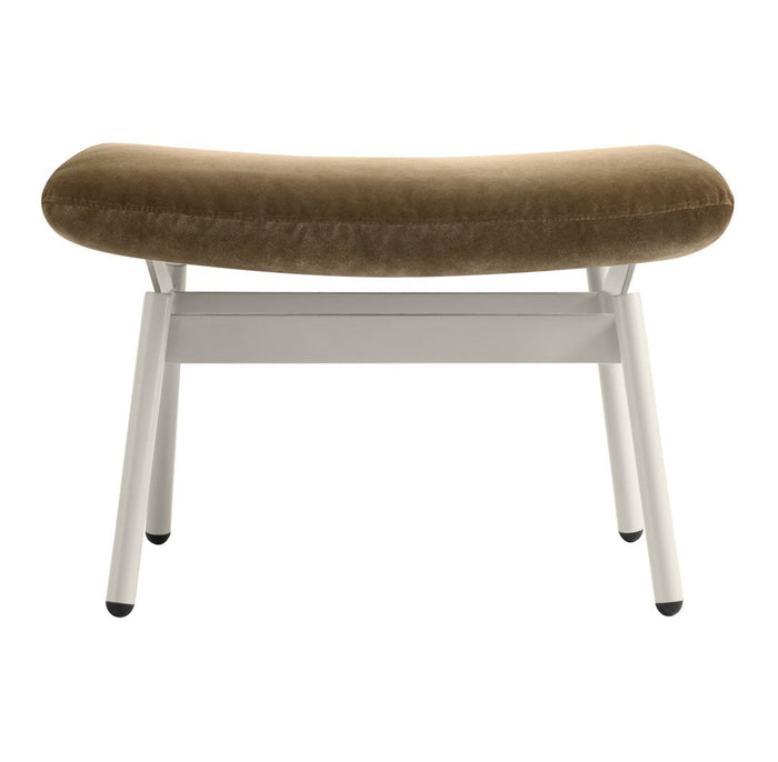 Brown velvet bench with a curved seat and white metal legs, featuring a modern minimalist design.