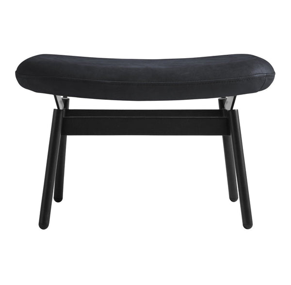Black upholstered bench with a sleek curved design and sturdy black wooden legs. Modern and minimalist style.