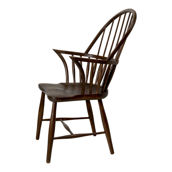 Dark wooden chair with a classic spindled back design and smooth finish. Elegant and timeless in style.