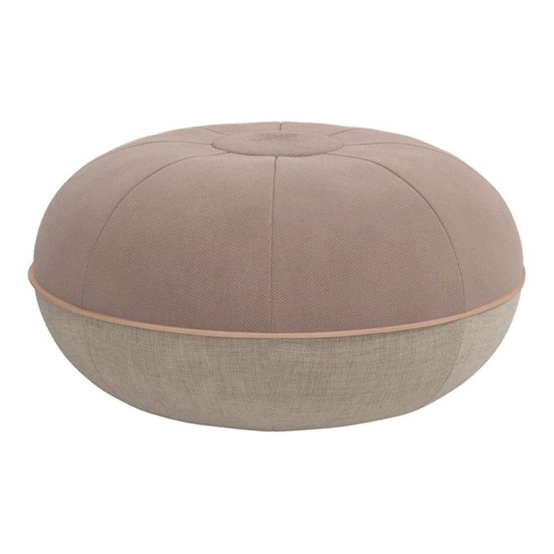 Soft beige and light brown pouf with a textured, round design and contrasting fabric patterns. Ideal for modern decor.