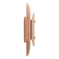 Blush pink wall decor with smooth, rounded shapes and minimalist design. Perfect for modern interiors.