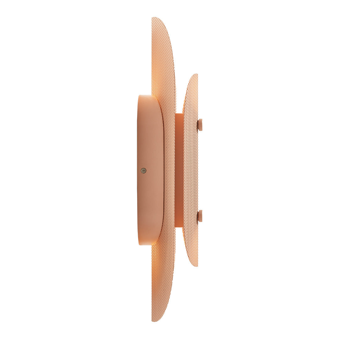 Soft peach wall light with smooth curves and minimalist design, enhancing modern décor.
