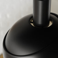 Close-up of a black lampshade with a blurred background