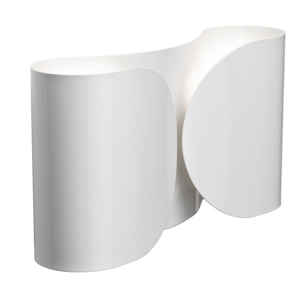 Sleek white lamp with smooth curves and minimalistic design, showcasing a modern aesthetic and elegant simplicity.